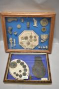 Two framed and glazed displays of Detector Finds, frame 1 contains Georgian and Victorian Bronze