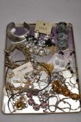 A tray of costume jewellery including necklaces, bangle, crucifix etc
