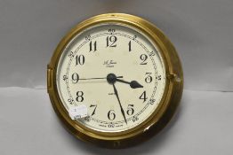 A 20th century St James London ships style port hole clock having brass case