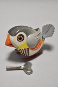 A 20th century tin plate toy bird marked Made in west Germany with key