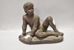 A 20th century resin figure study of a seated boy