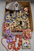 A large selection of costume jewellery, beads, broaches, etc