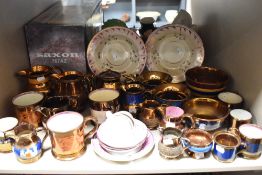 A large quantity of predominantly Victorian lustre and gilt detailed jugs, cups and saucers, bowls