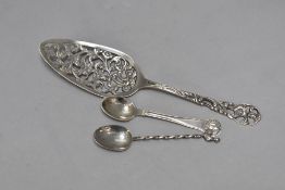 A white metal cake slice bearing marks having extensive moulding decoration, a Danish Silver