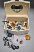 A jewellery box and contents including beaded necklaces