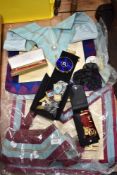 A selection of Masonic items to include bag, brooches and more.