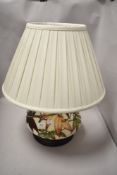 An early 20th century Moorcroft Pottery Sumac Tree pattern table lamp base designed by Phillip