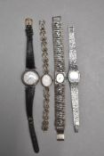 Three HM silver wrist watches, two having attached silver decorative straps, a black leather strap