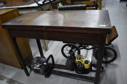A Victorian oak gate leg table with fold out top