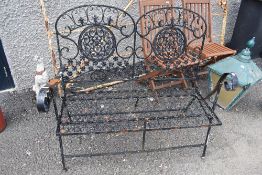 A lightweight wrought iron garden bench