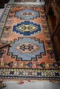 A woolen rug or carpet in an Kazak style