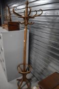A modern steamed wood coat and hat stand