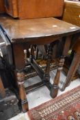 A traditional stained frame gateleg dining table