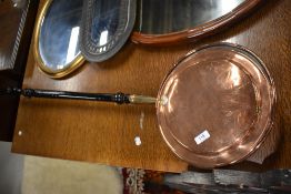 A 19th copper warming pan