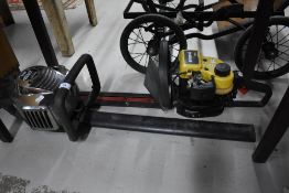 Two modern petrol hedge trimmers McCulloch HT 555 and Sabre hts53