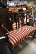 A Victorian two seat couch having carved mahogany frame