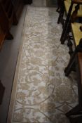 A modern carpet square/rug in light cream and white