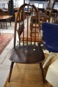 A dark stained Ercol high back dining chair