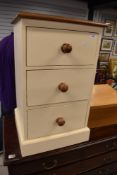A modern painted three drawer chest of bedside or similar drawers