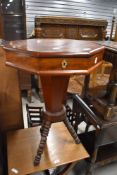 A 19th Century sewing table having fitted interior , on interesting bobbin turned legs
