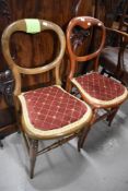 Two Victorian balloon back chairs having beech wood frames with modern upholstery