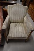 An Edwardian arm chair having mahogany frame