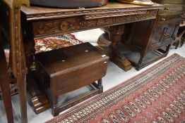 An early to mid 20th Century oak extending dining table