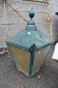 A traditional street lamp top, in green finish
