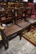 Early 19th century oak provincial style solid seat farm house chairs one matching pair plus one