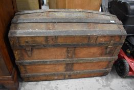A 19th Century oak kist having mahogany crossbanded decoration, dummy top drawers, long centre and