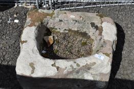A traditional sandstone trough of small proportions