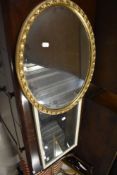 Two modern mirrors one oval and similar white painted frame