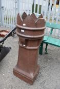 A traditional clay chimney pot, some damage to the crown