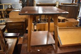 A 20th century side table having revolving top