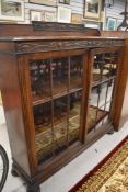 An early 20th Century oak display cabinet/bookcase