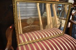 A modern gilt effect framed mirror