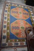 A vintage carpet rug in a traditional design