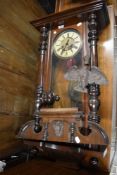 A 20th century Vienna style wall clock with mahogany case