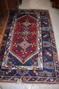 A 20th century carpet rug in wool having traditional oriental design 1.75m x 1.19m