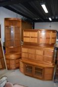 A selection of mid century Nathan teak furniture including two low corner cupboards, double drawer