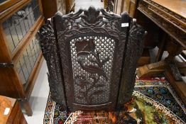 An early 20th century Chinese carved wood privacy screen