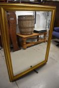A modern hall way mirror having gesso style gilt frame