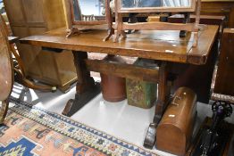 An oak dining or priory table in a vernacular design possibly 18th century having had the top re