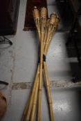 A set of Hawiian style garden torches