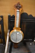 A modern mahogany banjo style barometer