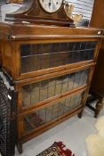 An early 20th century Globe Wernicke three section bookcase with leaded light doors