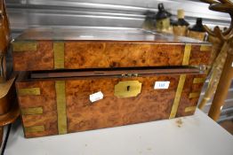 A Victorian writing slope having brass banding with oyster burr veneer