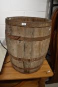 A vintage coopered wooden barrel with handles