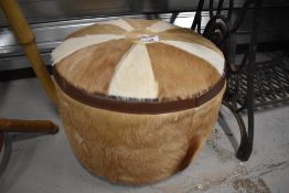 An animal hide foot stool