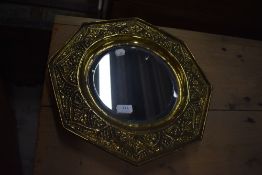 A brass tray mirror